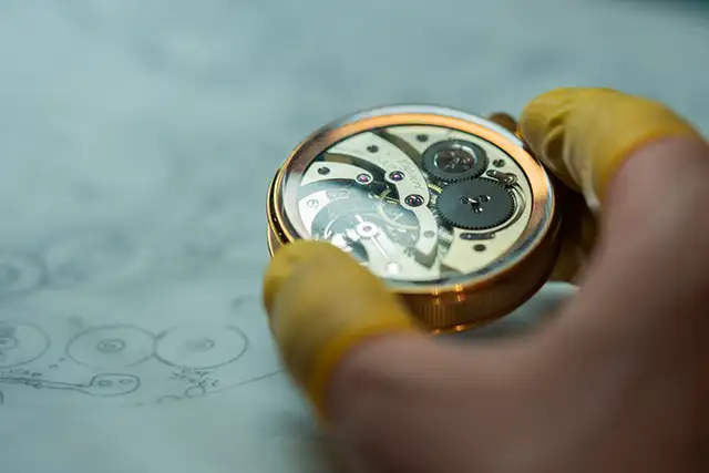 Watchmaker working on an antique watch in Geneva