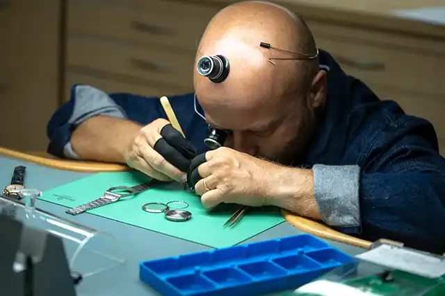  Watchmaker performing a complete revision of a watch in Geneva – The Watch Lab Genève